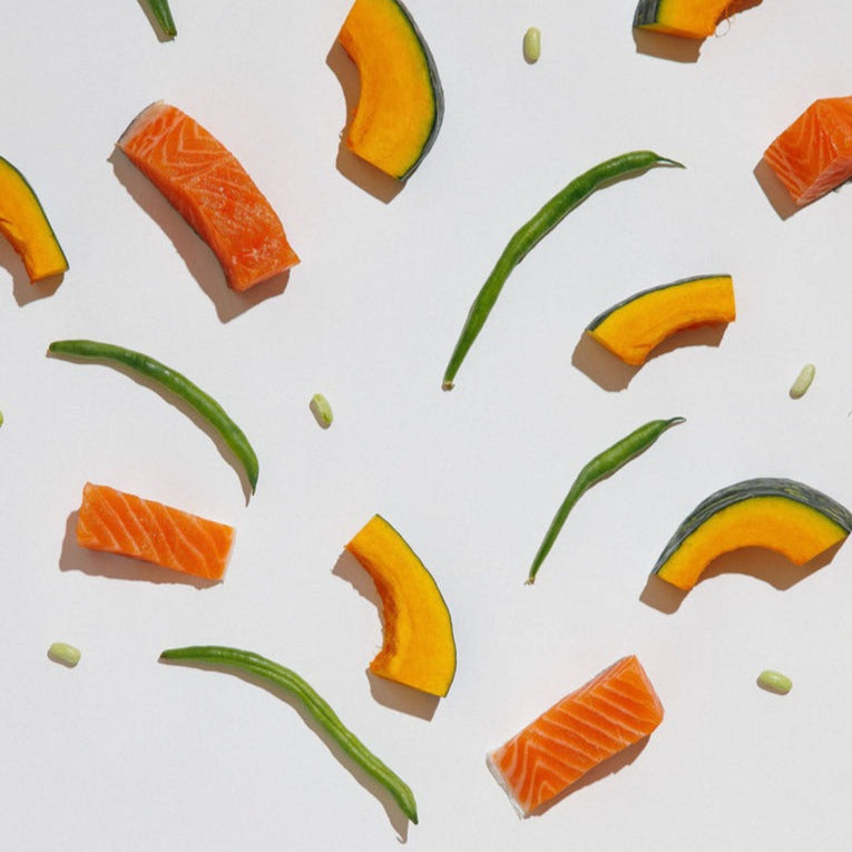 Fruit and vegetable pieces arranged in a tree-like pattern with a 'Rigby' product packaging at the base.
