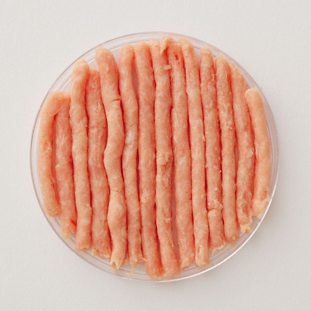 Fresh ground turkey in a glass dish, viewed from above.